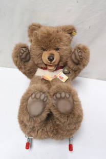 A Steiff bear on wheel: A Steiff bear on wheel, 17.7"x21.4"x10.2"