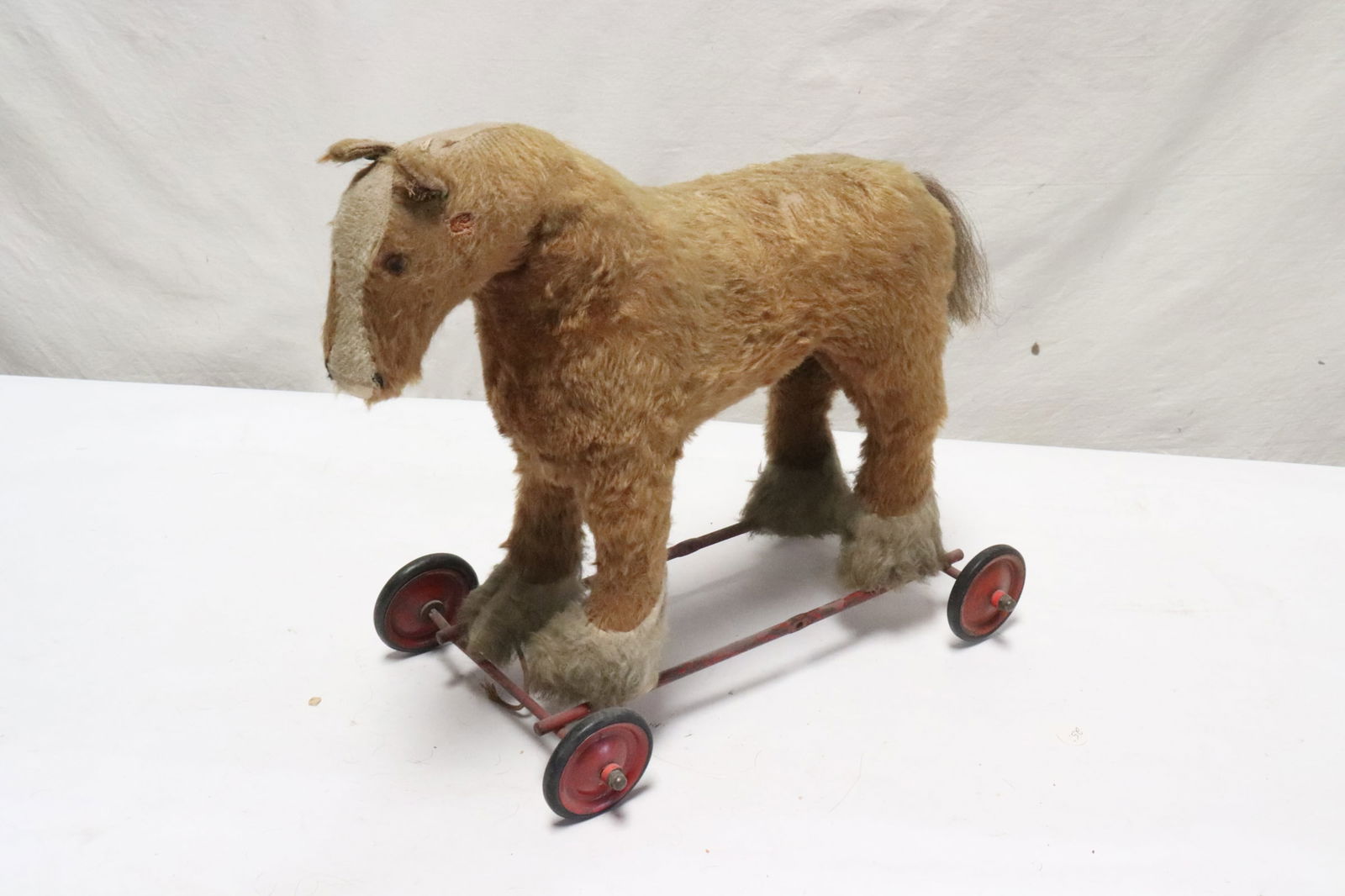 A vintage mohair horse on wheel: A vintage mohair horse on wheel, 12.8"x14.8"x9.3"