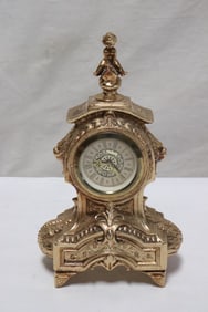 A small brass cased table clock