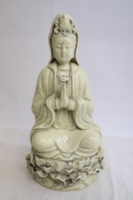 A blanc de shin porcelain sculpture of Guanyin