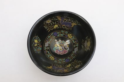 An enamel on black earthenware bowl