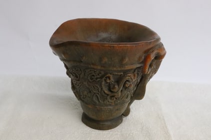 A horn style carved libation cup