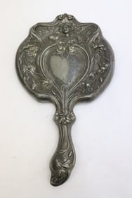 An art nouveau silverplate hand mirror
