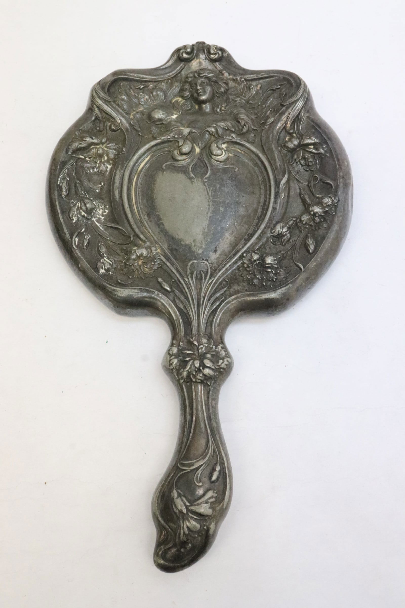 An art nouveau silverplate hand mirror (1 of 7)