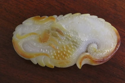 A white jade like carving of dragon