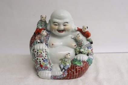 Famille rose porcelain deity
