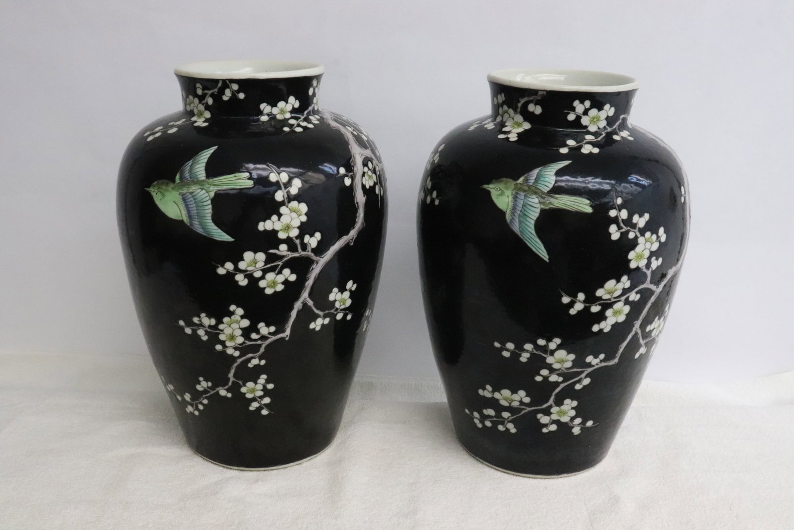 Pair Chinese vintage famille noire porcelain jars: Pair Chinese vintage famille noire porcelain jars, drilled, 12"x8.35"dia ea