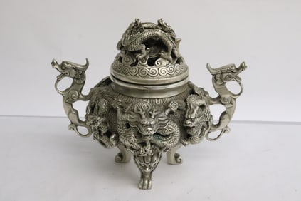 A very fancy white bronze covered censer