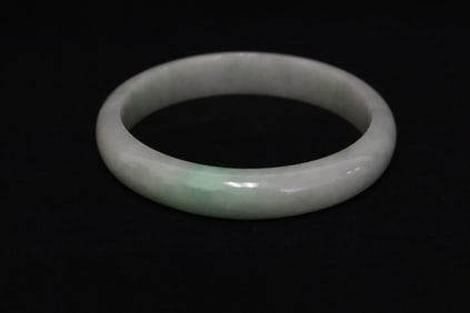 A natural color light apple green jadeite bangle w/ GIA certificate