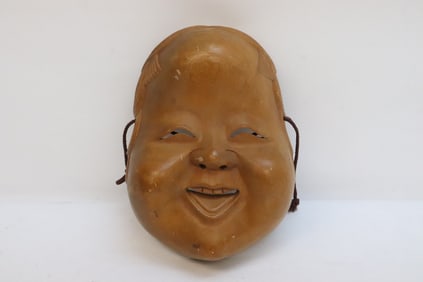 A wood carved Japanese mask