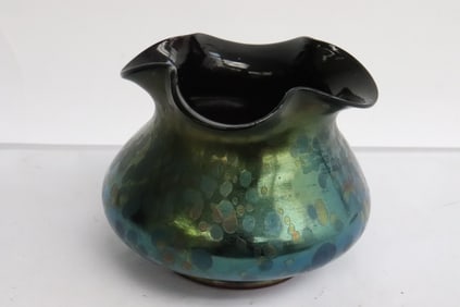 A Loetz iridescent art glass jar
