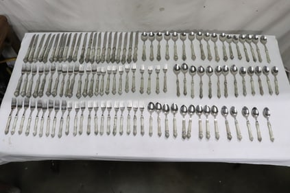 A large fancy serving for 12 silverplate flatware set