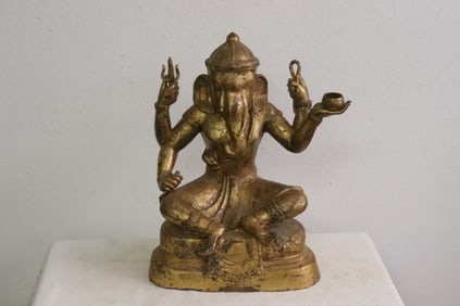 A gilt bronze sculpture of Ganesha