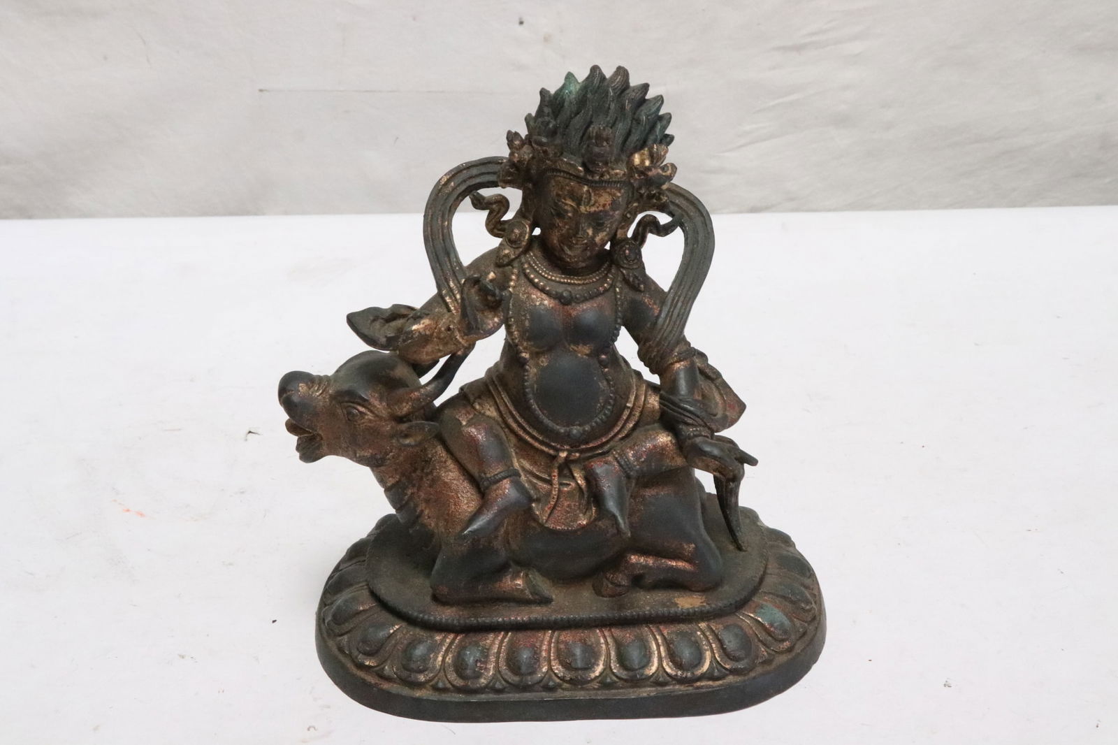 A vintage Chinese very heavy gilt bronze sculpture: A vintage Chinese very heavy gilt bronze sculpture of deity, 8.75"x8"x4.75"