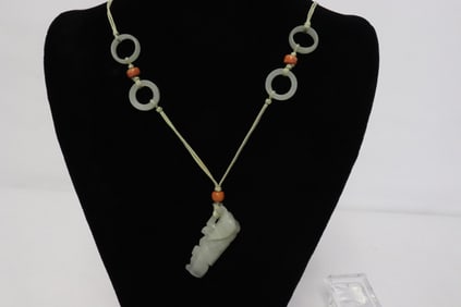 A 19th c. white jade carving w/ a necklace