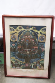 A framed hand painted thangka