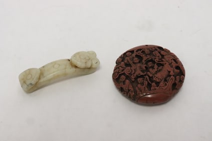 a white jade belt buckle, & a cinnabar style pendant