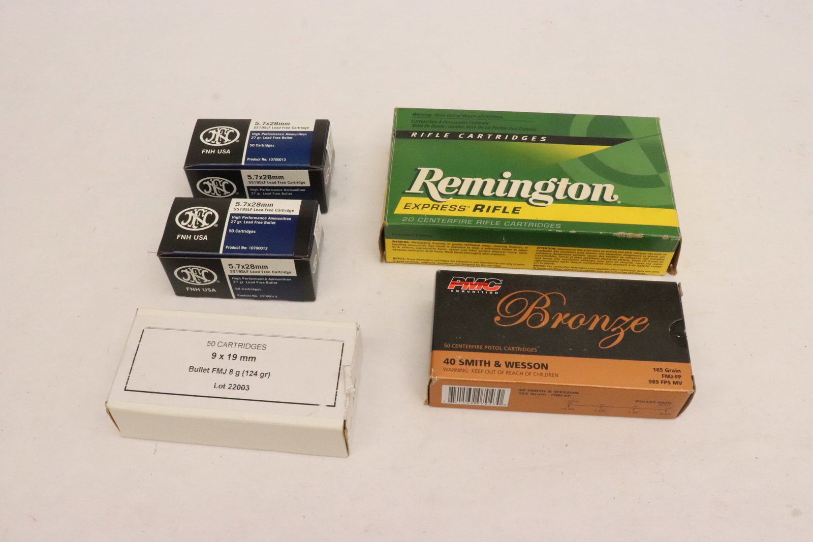 5 boxes of ammo: FNA ammo, 5.7x28mm, lead free bullet, 27gr., 50/box, 2 boxes, Bronze 40 Smith & Wesson, 50/box, 1 box, Remington cartridge, 20/box, 1 box, 9x19mm FMJ 124gr., 50/box, 1 box