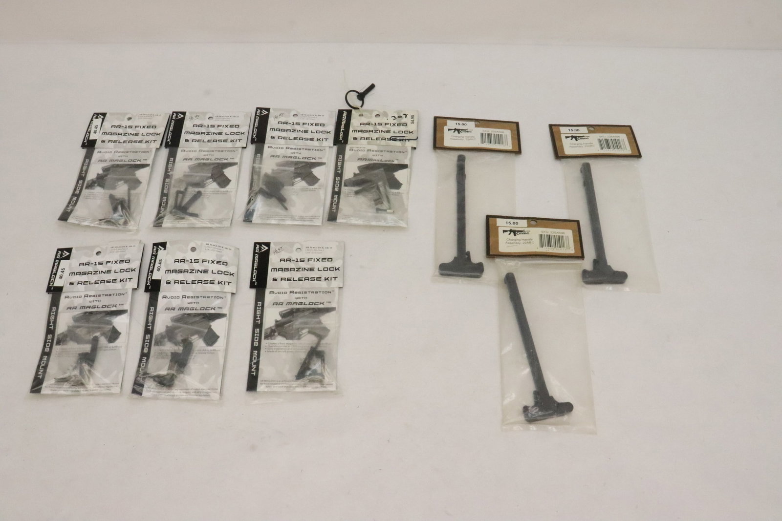 3 charging handles (22ARC), and 7 AR-15 fixed magazine lock and release kits: 3 charging handles (22ARC), and 7 AR-15 fixed magazine lock and release kits