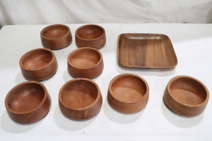 8 teak wood bowls, and a teak wood tray