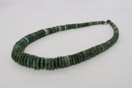 A necklace w/ jadeite like stone discs & sterling clasp