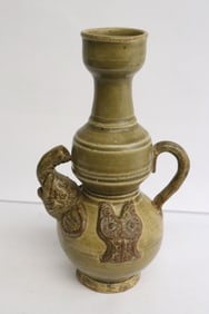 A vintage celadon porcelain handled vase