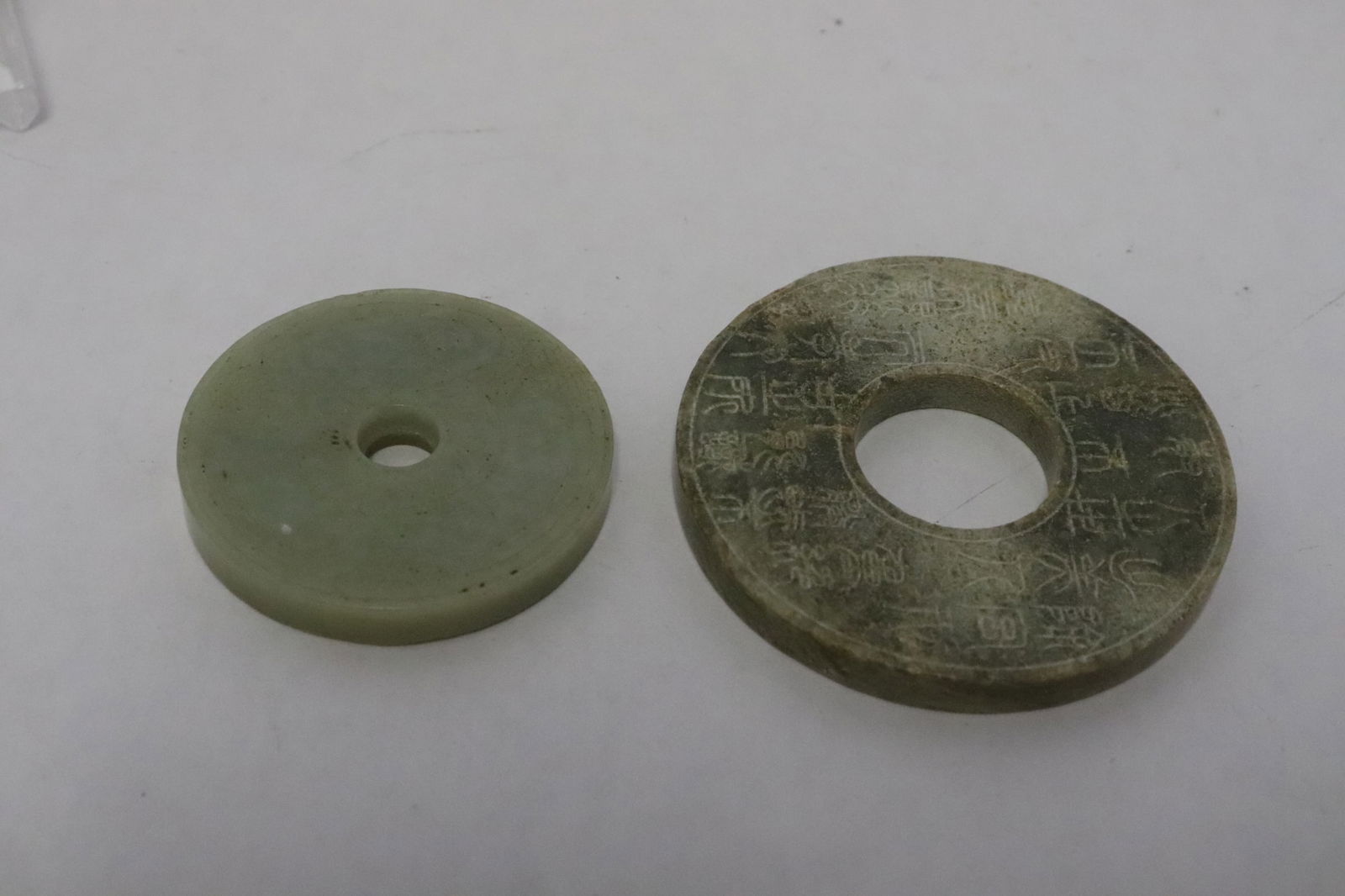 2 Chinese jade like stone carved discs (1 of 9)