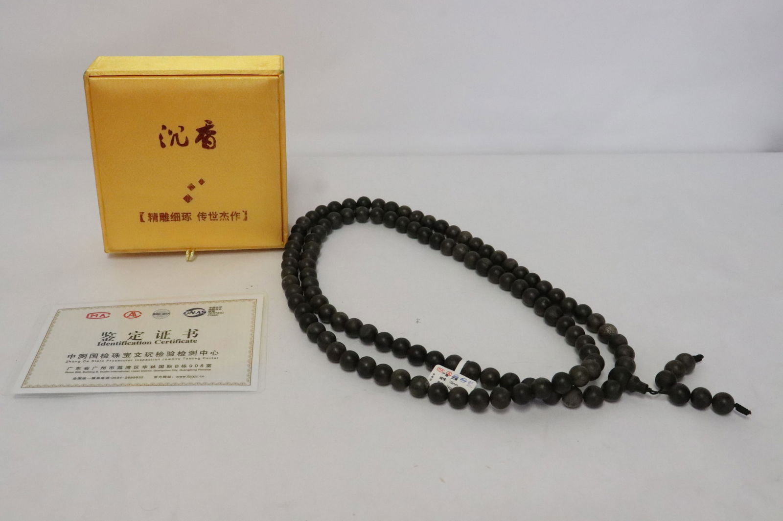 A chenxiang wood bead necklace: A chenxiang wood bead (0.37"x0.37"dia ea) necklace (46"L) (box:1.65"x4.65"x4.65")