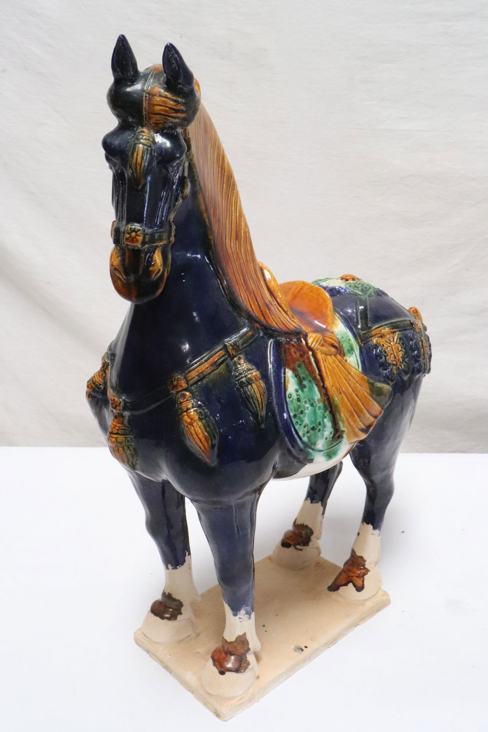 A sancai earthenware horse: A sancai earthenware horse, 16.85"H