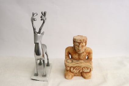 A Talc statue, and a chrome statue of deer