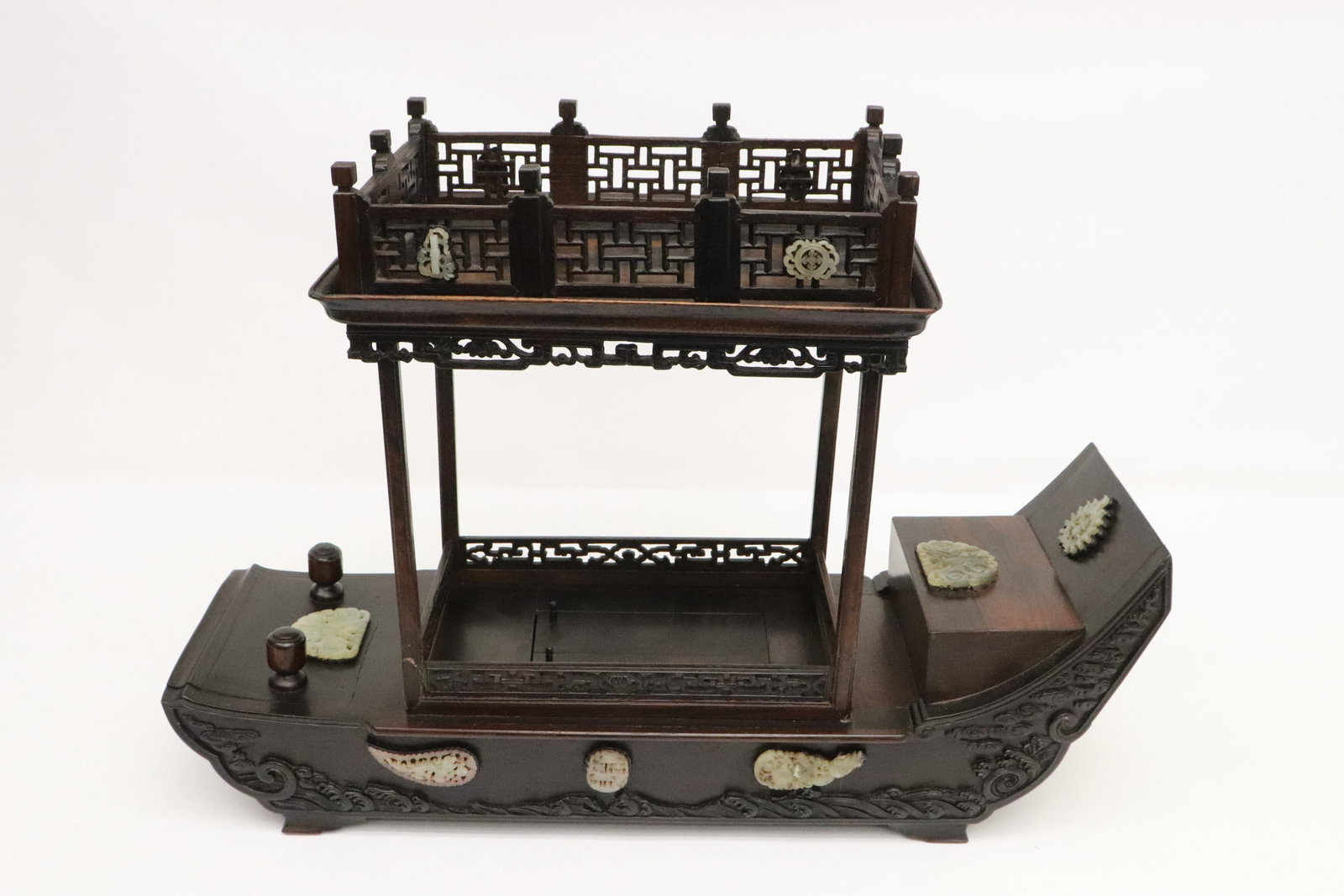 zitan chest mounted with jade carved ornaments: An important zitan chest in the form of boat with secret drawers for jewels, mounted with jade carved ornaments, 16"x22.5"x8.8"