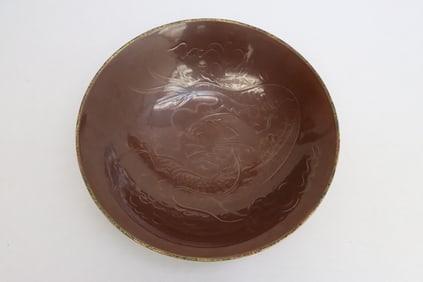 A brown glazed large porcelain bowl
