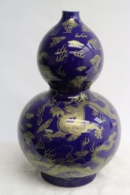 Chinese gold on blue porcelain gourd shape vase