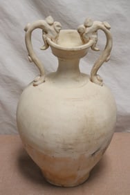 A Tang style white porcelain handled vase