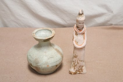 An earthenware vase, and a sancai style figure