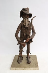 A paper mache figure of mountain man