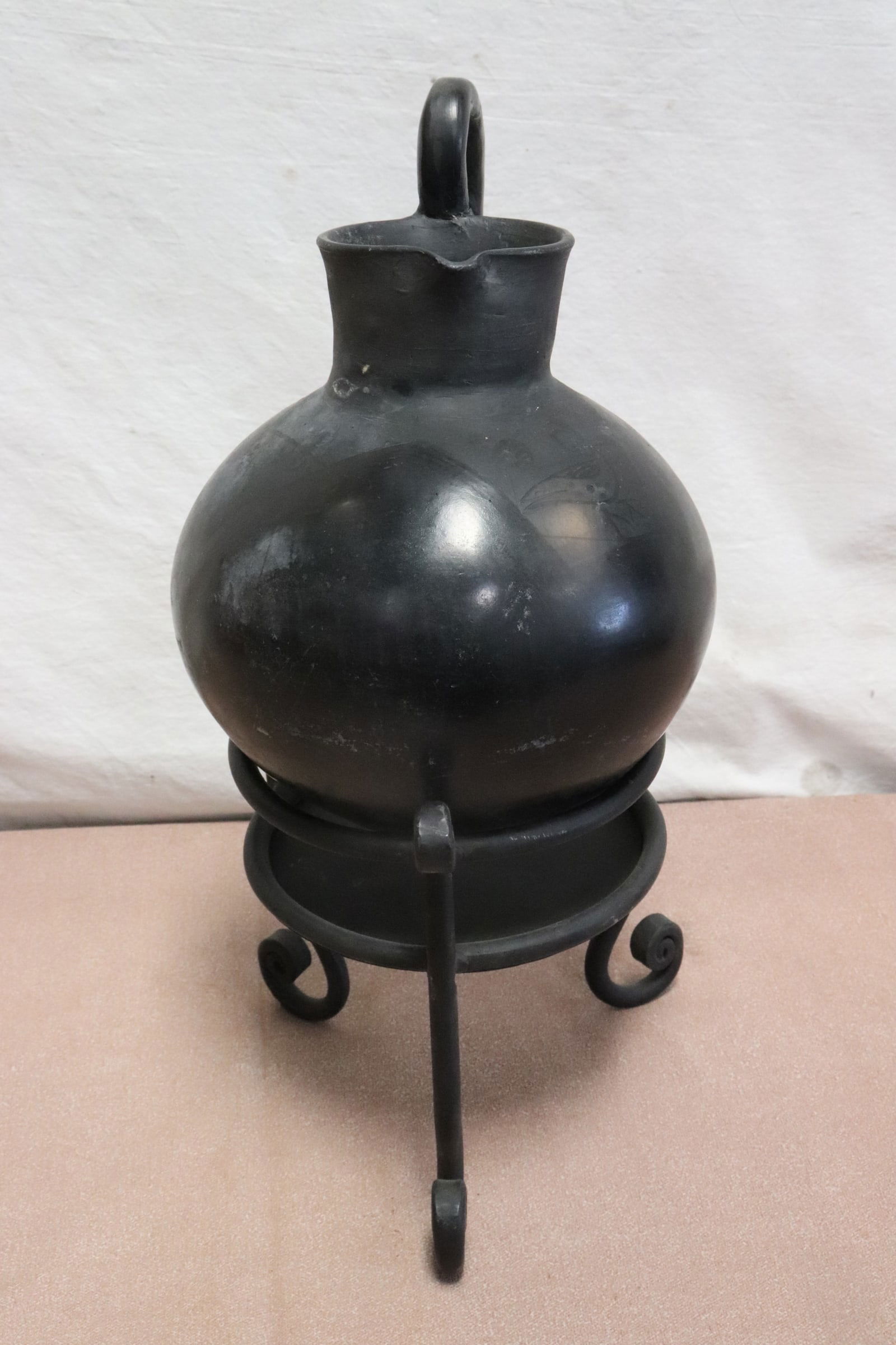 Black earthenware jar on stand, handle repair (1 of 12)