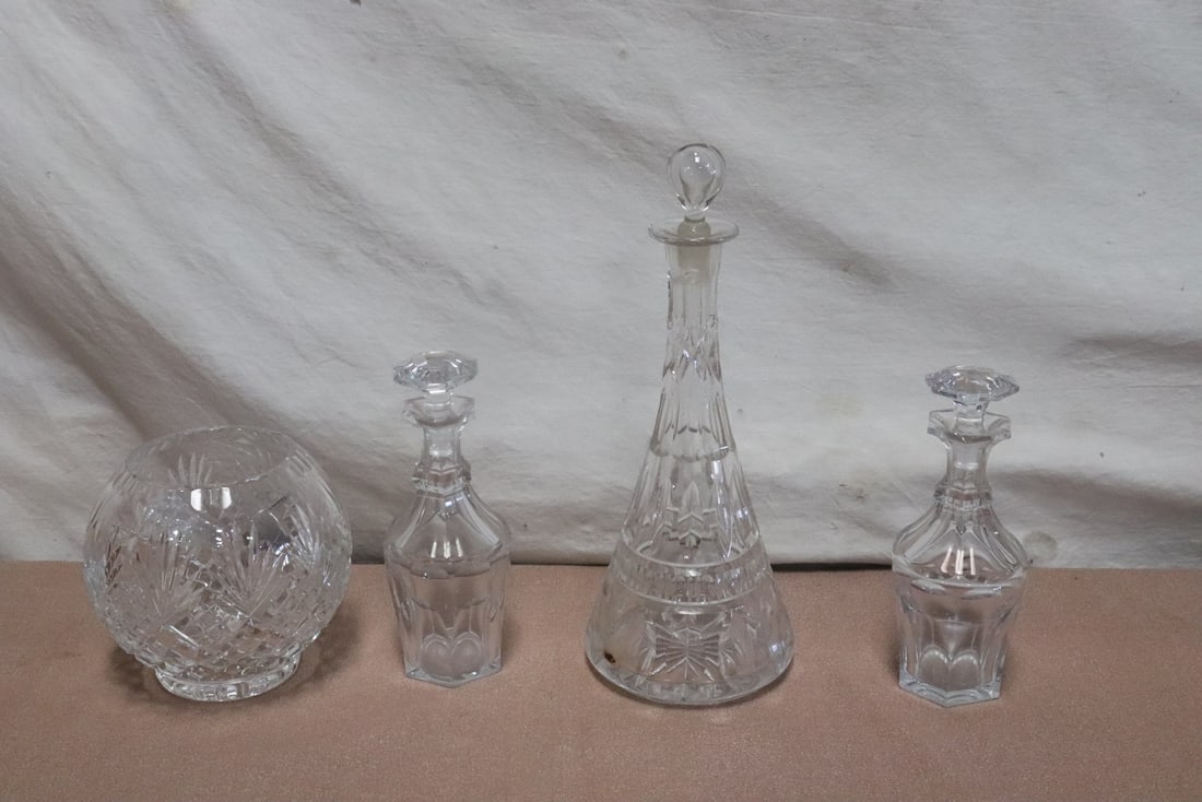 4 pieces crystals: 4 pieces crystals; 3 wine decanters (one has hairline) (8"x3.2"dia - 13.15"x5.2"dia), and a rose quartz bowl (5.8"x6.3"dia)