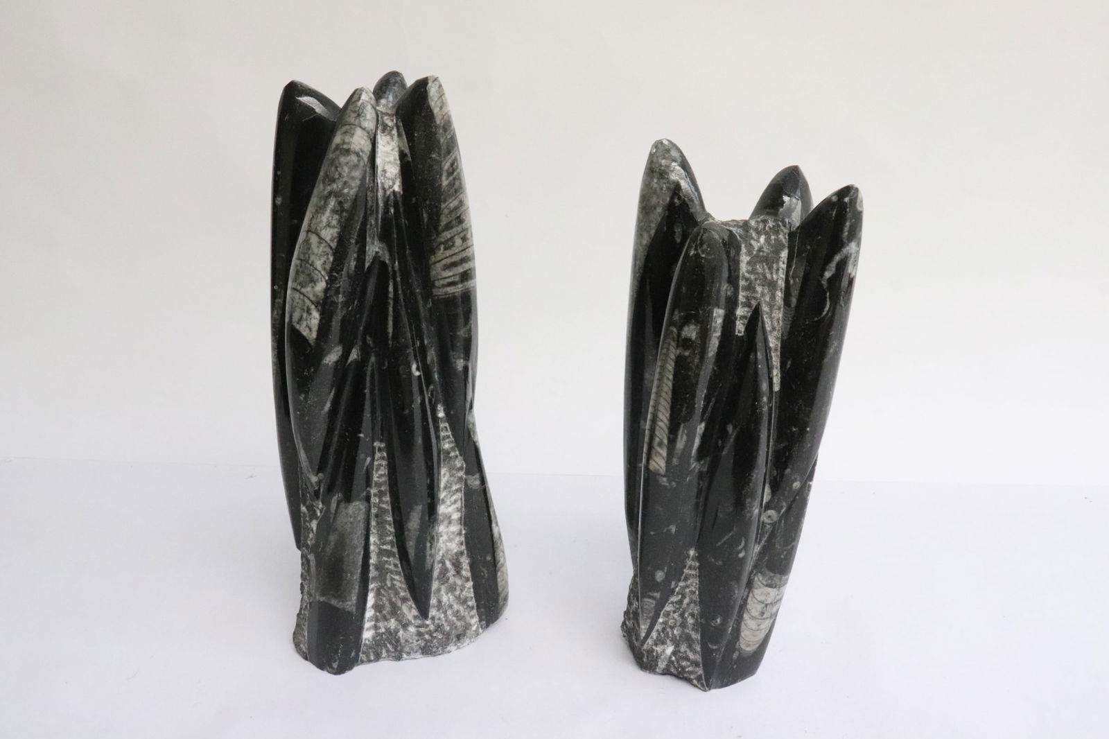 2 trilobite fossil towers: 2 trilobite fossil towers, 7.7"H, 8.65"H