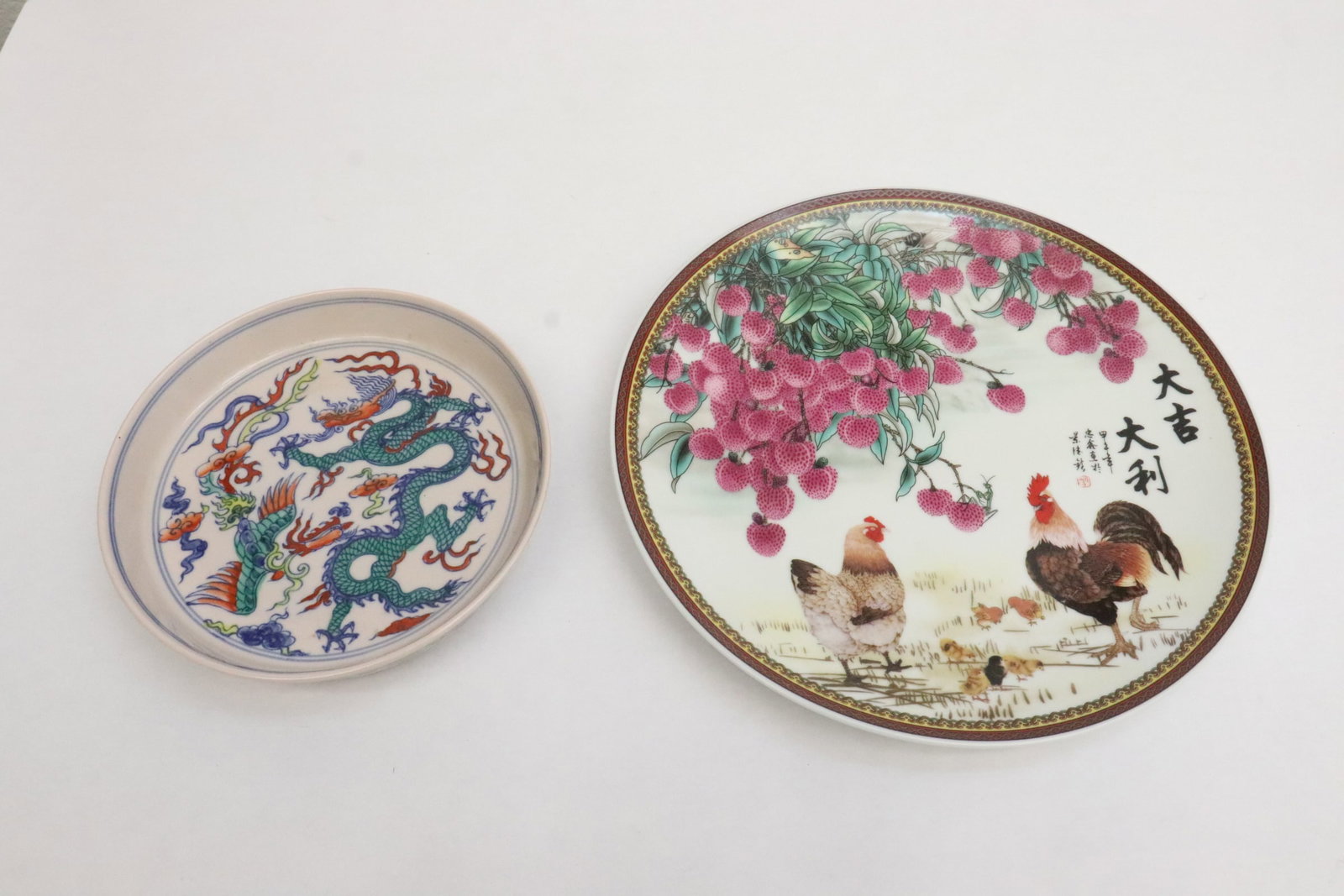 2 wucai porcelain plates: 2 wucai porcelain plates, 1.35"x6.8"dia, 1.1"x10.25"dia