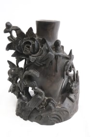 A wood carved vase