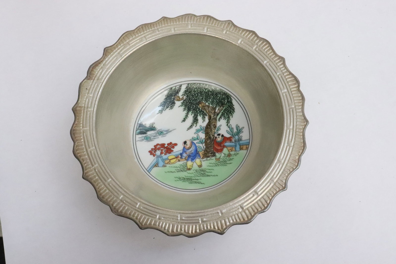 A silver rimmed porcelain bowl: A silver rimmed porcelain bowl, 3"x7.6"dia