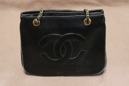 A Chanel style black leather bag