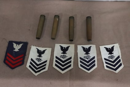 5 WWII military patches, and 4 WWII gun shells
