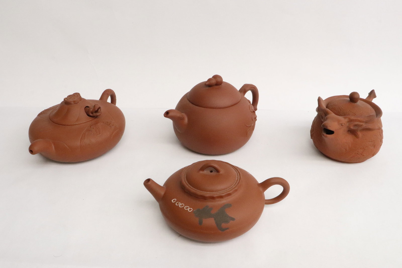 4 Yixing teapots: 4 Yixing teapots, 2.6"x5.5"x4" - 3.65"x5.7"x4.15"