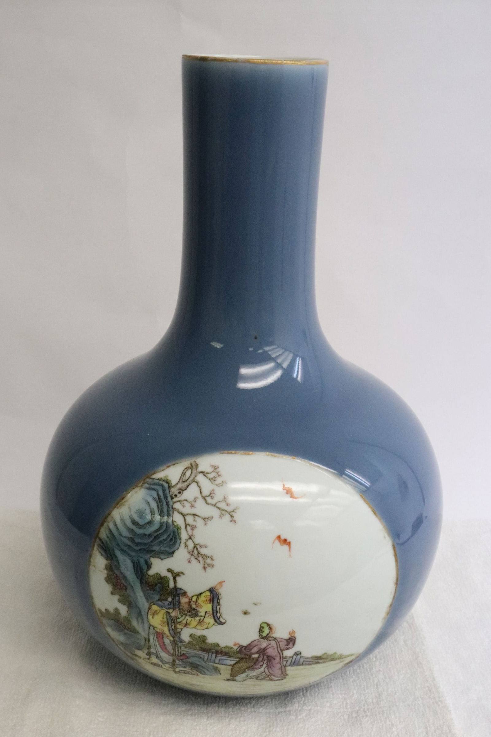 Chinese antique light blue porcelain bottle vase: Chinese antique light blue porcelain bottle vase, panel painted with fairy tale scenes, hairline, 12.5"x8.4"dia