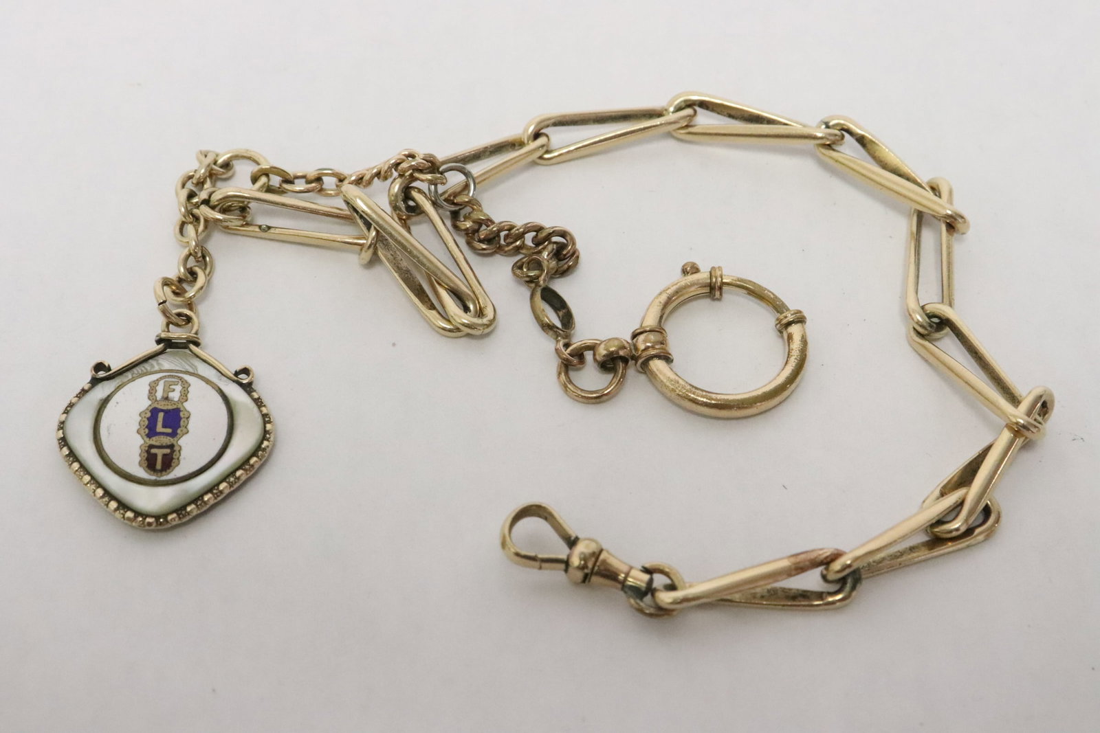 A gold filled watch fob: A gold filled watch fob, wt. 30gm, 15"L