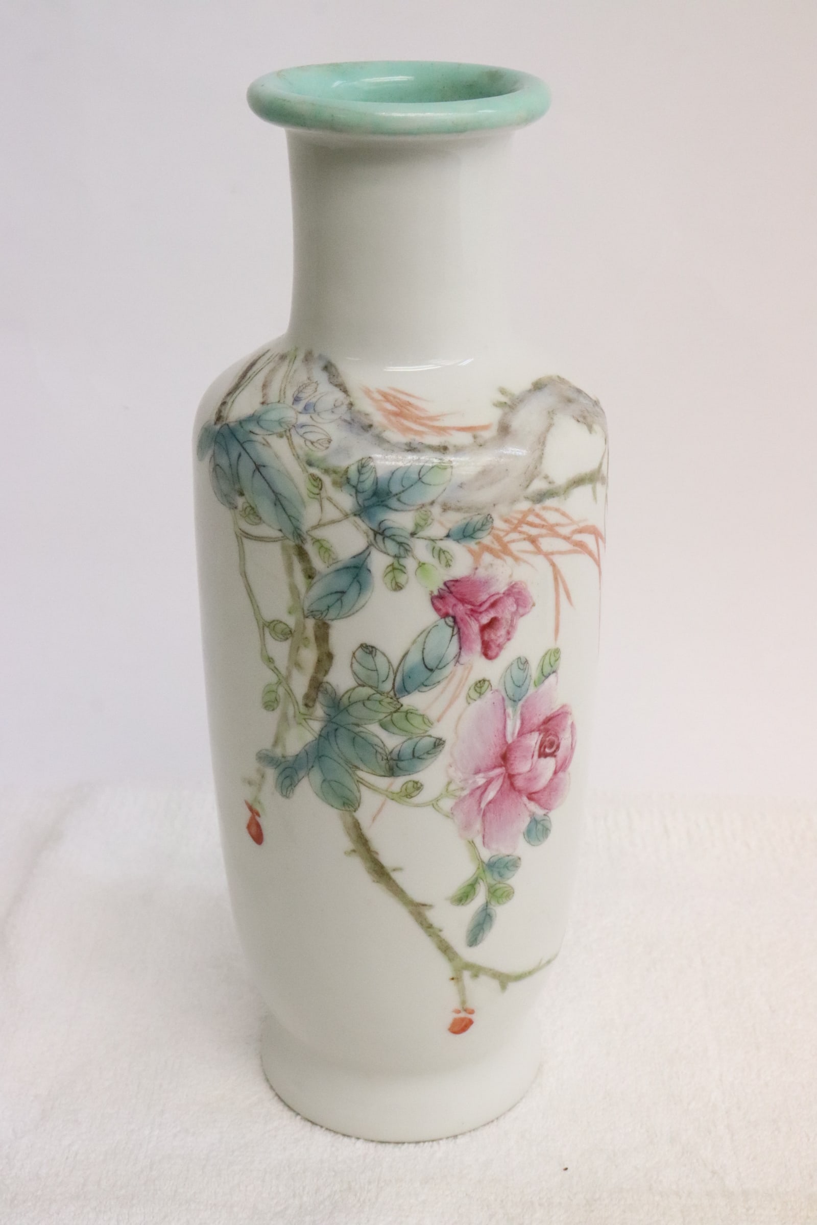 A late 19th century Chinese porcelain vase: A late 19th century Chinese famille rose porcelain vase, 9.25"x3.65"dia