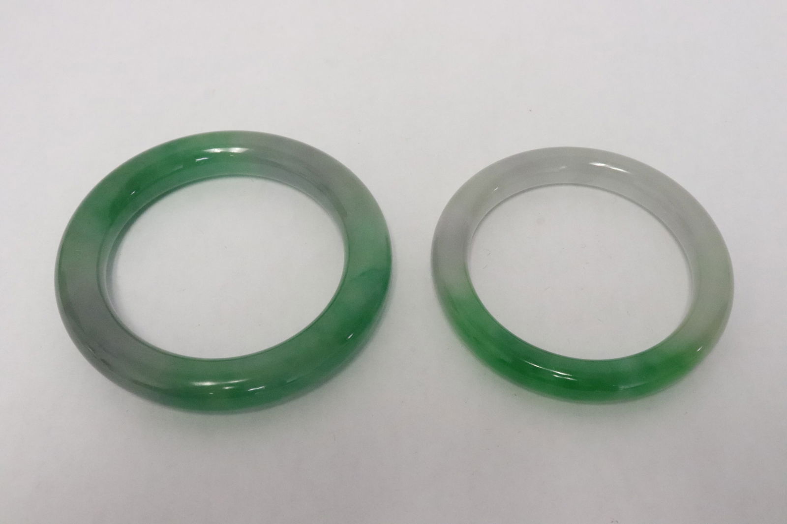 2 jadeite like bangles: 2 jadeite like bangles, 0.35"x2.9"dia, 0.43"x3.25"dia