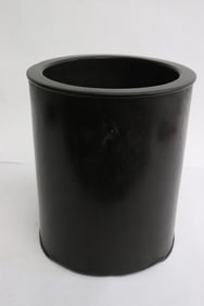 A wood carved brush holder